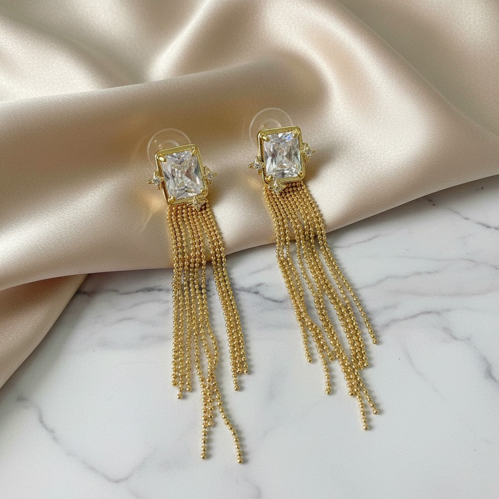 elephantina.gr gold long earrings with clear rectangular crystal and delicate chains, ideal for formal events.