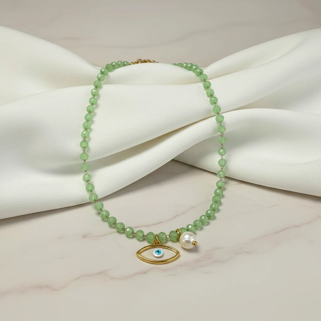 elephantina.gr necklace with green crystal beads, evil eye pendant, and pearl accent. 40cm + 5cm extension.