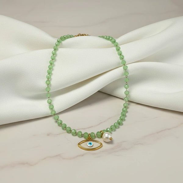 elephantina.gr necklace with green crystal beads, evil eye pendant, and pearl accent. 40cm + 5cm extension.