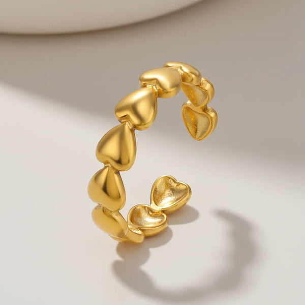 elephantina.gr gold stainless steel ring with a chain of embossed hearts, adjustable open design