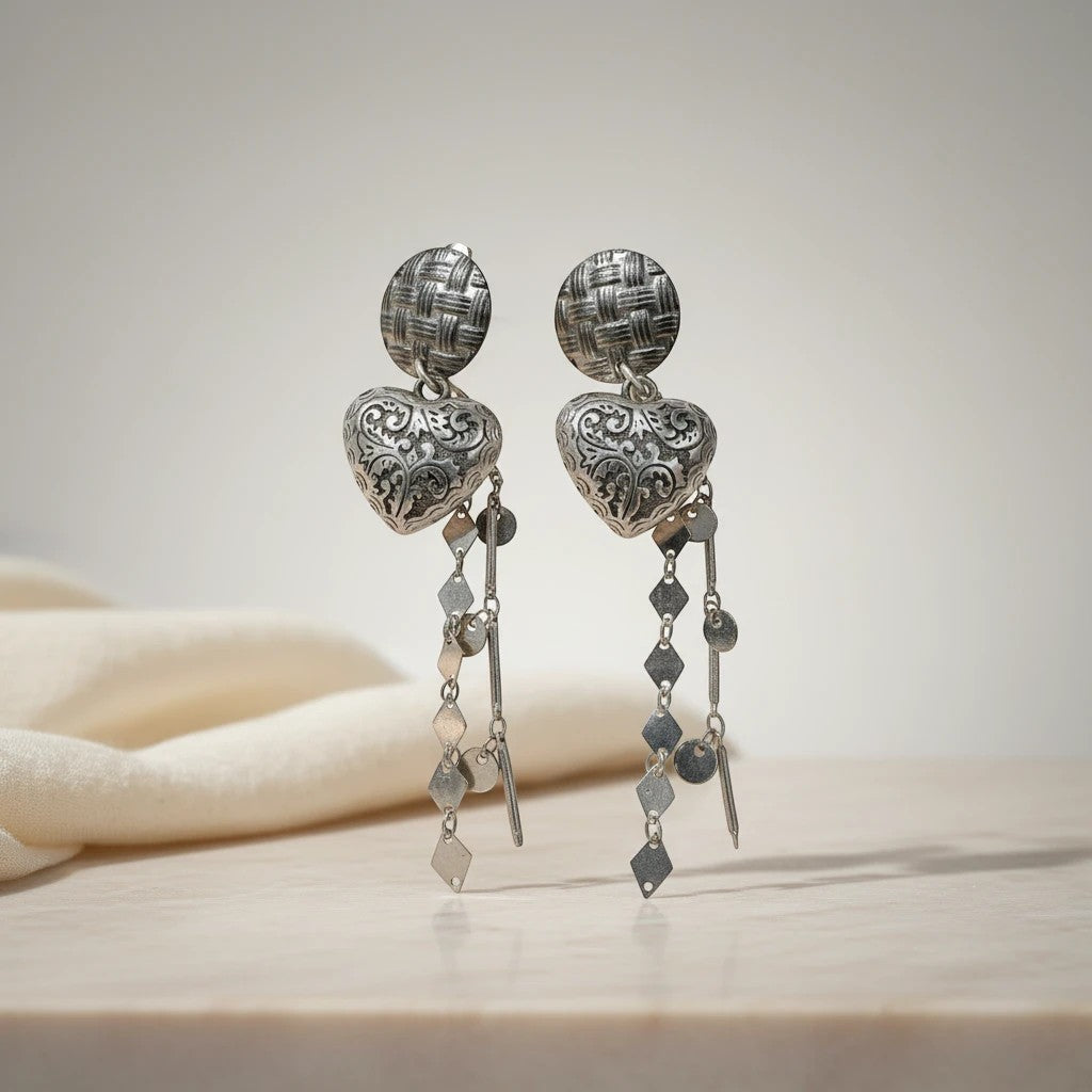 elephantina.gr silver-tone ornate heart dangle earrings with textured stud and chain tassels