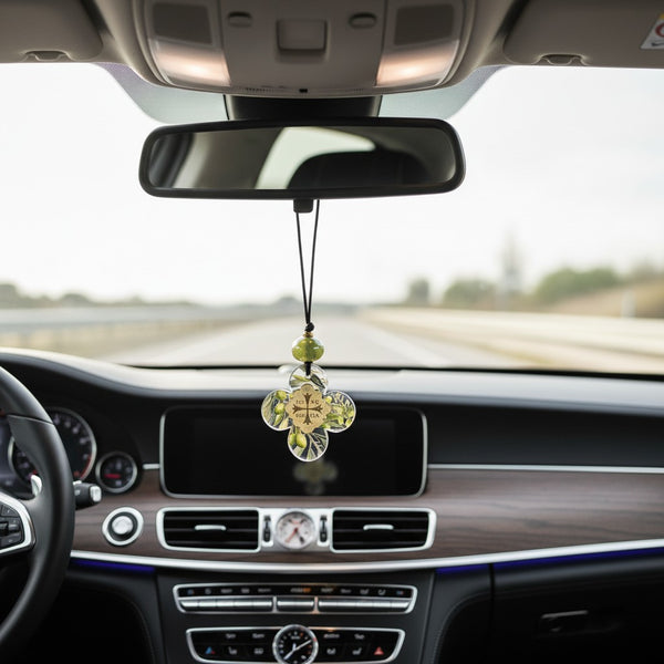 elephantina.gr religious ornament: clear acrylic cross with olive branch design, gold emblem, and green bead on black cord.