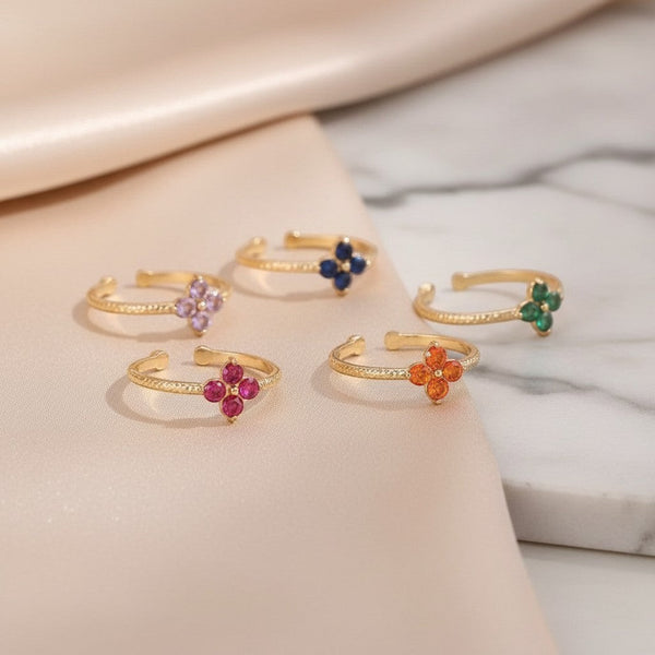 Elephantina.gr gold-plated steel ring with a flower design of colorful zircon stones in purple, blue, green, pink, and orange. Adjustable size.