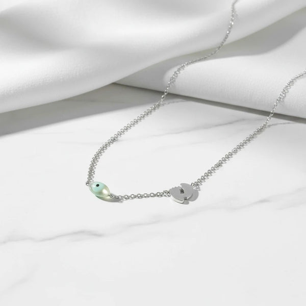 elephantina.gr silver-tone stainless steel necklace with baby footprint and mint evil eye charms. Minimalist, hypoallergenic.
