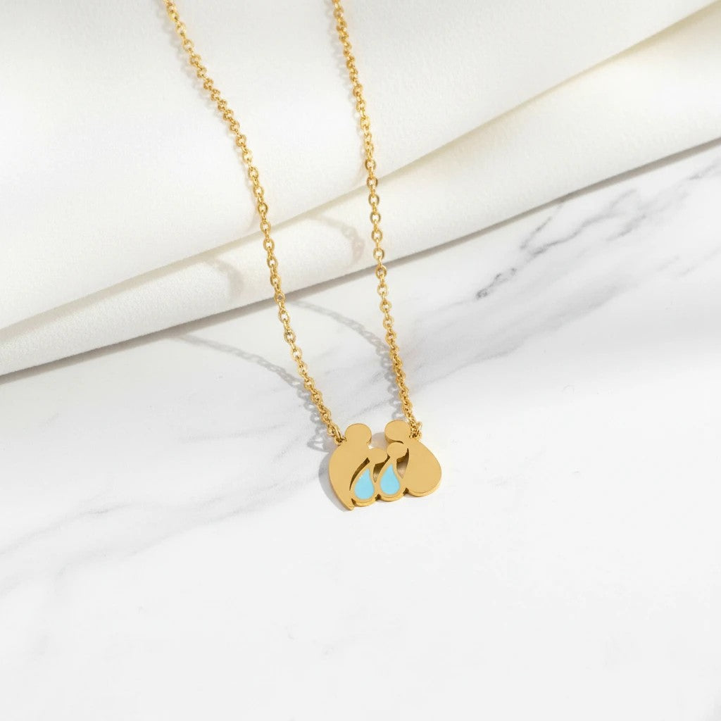 Elephantina.gr gold stainless steel necklace with family pendant: mom, dad, and two boys with blue accents.