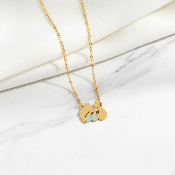 Elephantina.gr gold stainless steel necklace with family pendant: mom, dad, and two boys with blue accents.