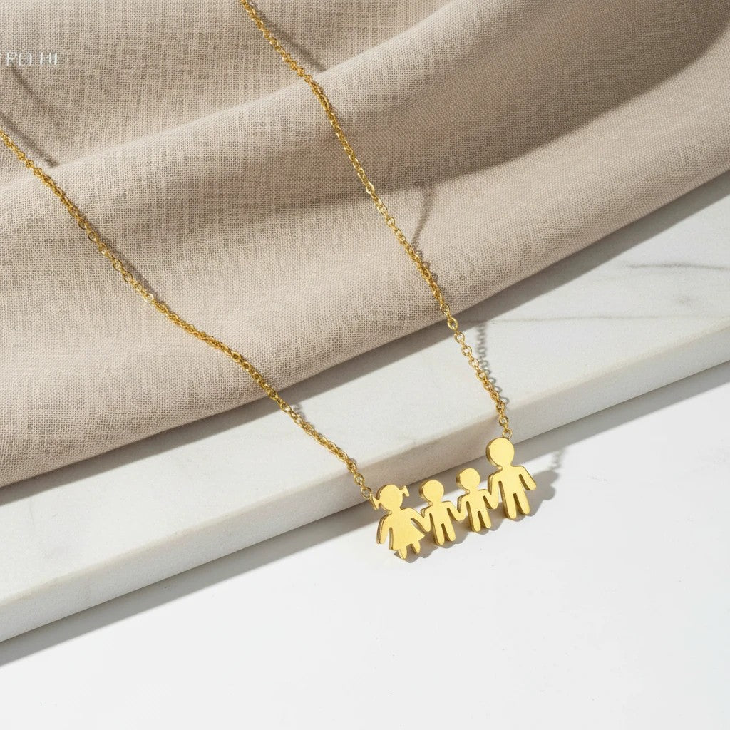 elephantina.gr gold stainless steel necklace with four family figures: mom, dad, and two children. Symbolizes family bonds.