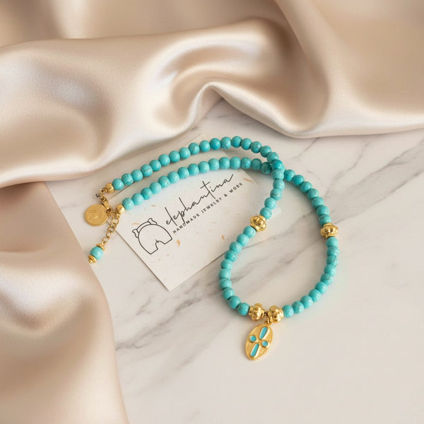 Elephantina.gr handmade gold-plated necklace with turquoise enamel and chalcedony beads. Features a pendant with turquoise inlay.