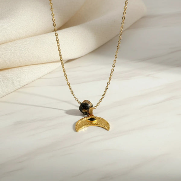Elephantina.gr gold plated necklace with black stone bead and crescent moon pendant with black eye detail.