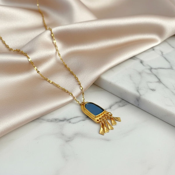 Elephantina.gr gold-tone stainless steel necklace with blue enamel pendant and dangling charms. 45cm + 5cm extension.