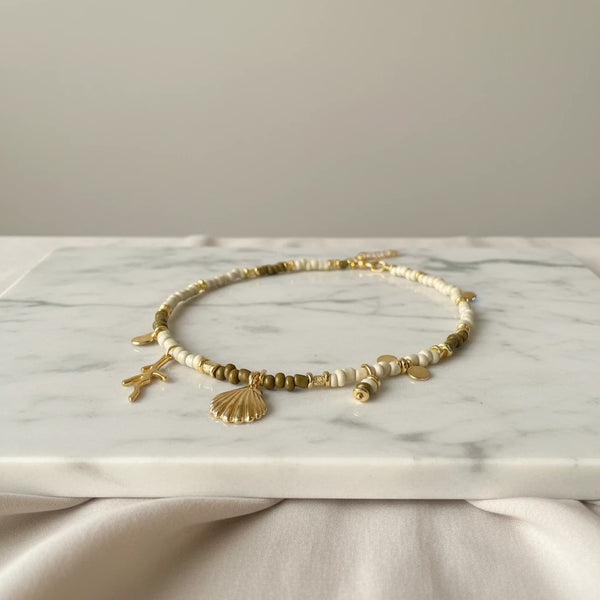 elephantina.gr two-tone beaded necklace with gold seashell, starfish, and pearl charms. 40cm + 5cm extension.