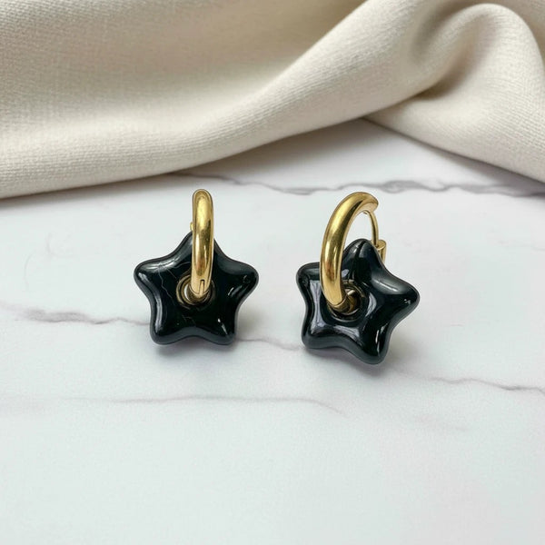 elephantina.gr gold plated hoop earrings with black agate star charms. Modern, chic, and bold.