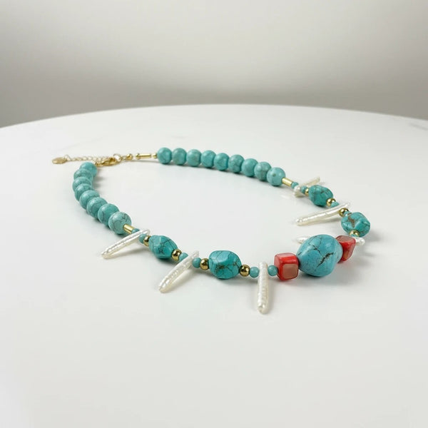 Elephantina.gr turquoise beaded necklace with pearls, coral beads, and gold accents. 45+5cm.