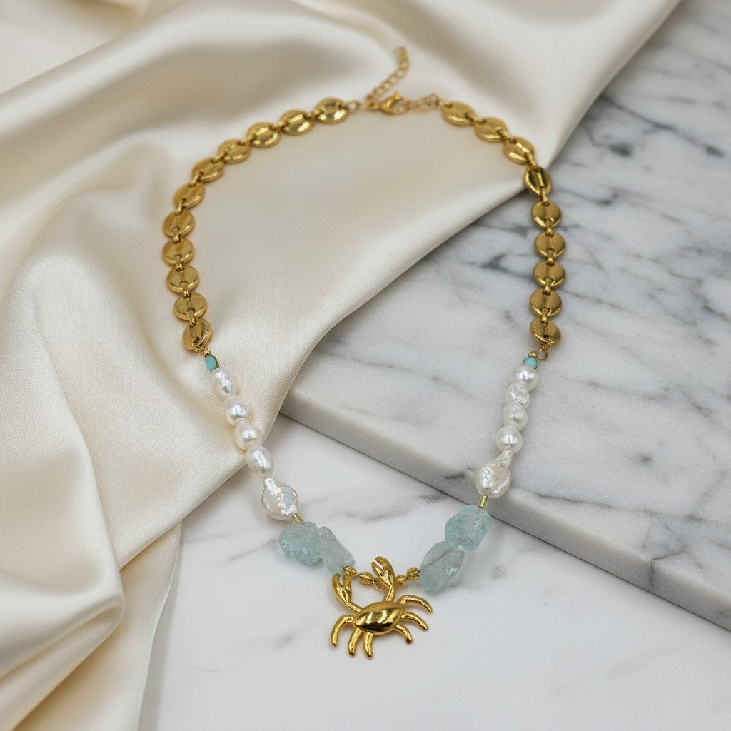 Elephantina.gr gold crab necklace with freshwater pearls, aquamarine stones, and unique chain. 55cm + 5cm extension.