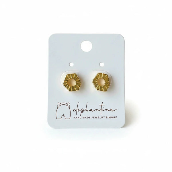 elephantina.gr 24K gold-plated brass minimalist hexagon stud earrings with titanium posts on display card.