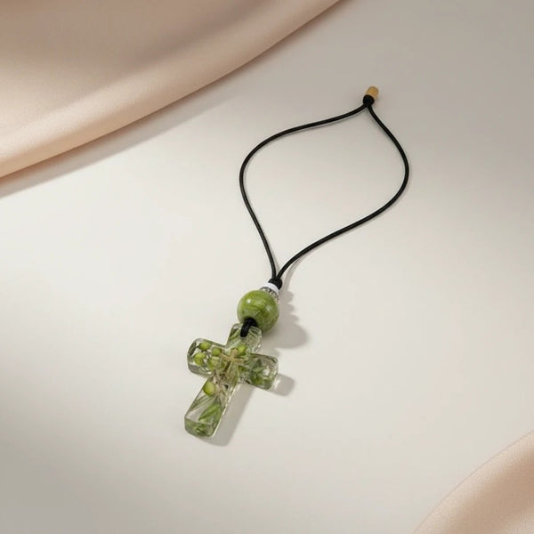 elephantina.gr clear resin cross pendant necklace with olive branches and green bead on black cord