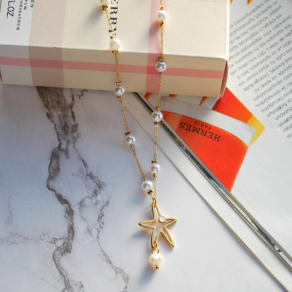 Κολιέ από ατσάλι με πέρλες και κρεμαστό στοιχείο