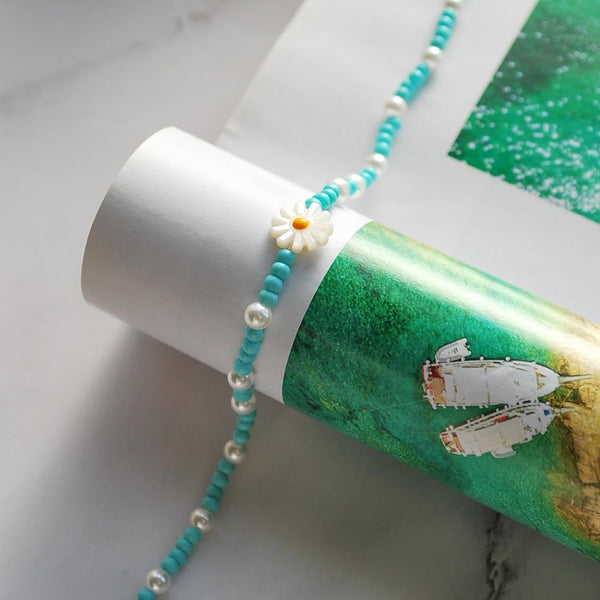 Βραχιόλι ποδιού με μπλε χάντρες και λουλούδι από φίλντισι