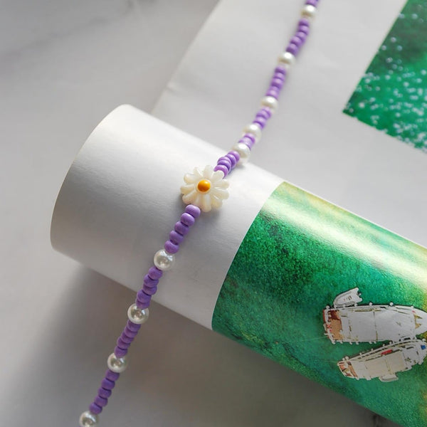 Βραχιόλι ποδιού με μωβ χάντρες και λουλούδι από φίλντισι