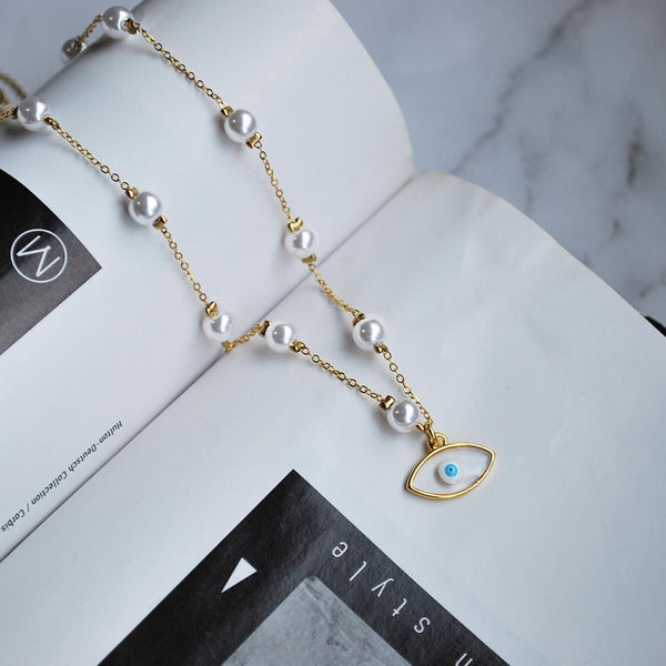 Κολιέ από ατσάλι με πέρλες και κρεμαστό στοιχείο σχιστό ματάκι