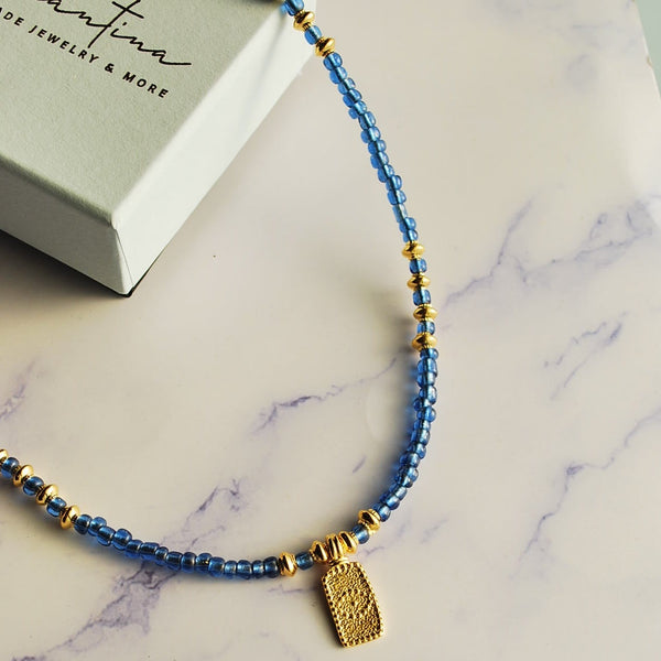 Κολιέ με γαλάζιες πέτρες και ματάκι κρεμαστό