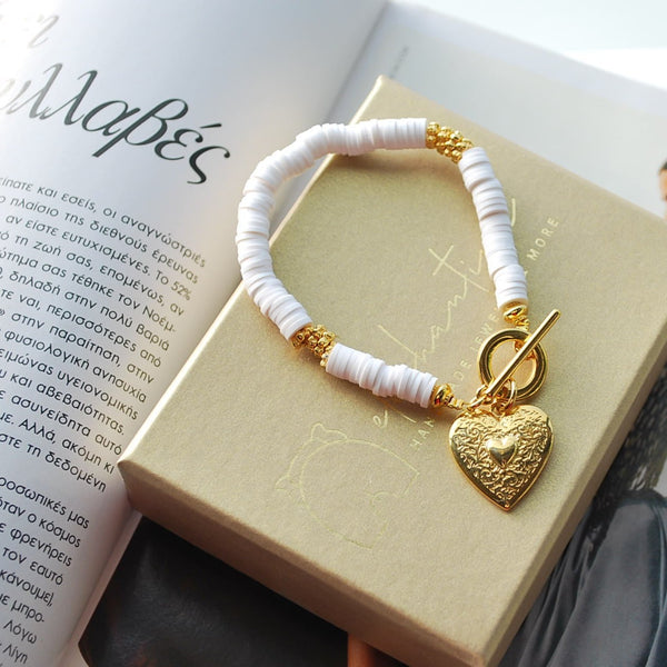 Βραχιόλι με λευκές ροδέλες και στοιχείο καρδιάς 24Κ