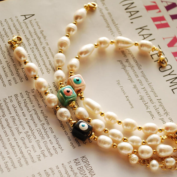 Βραχιόλι με λευκά μαργαριτάρια και χάντρα κύβο μάτι